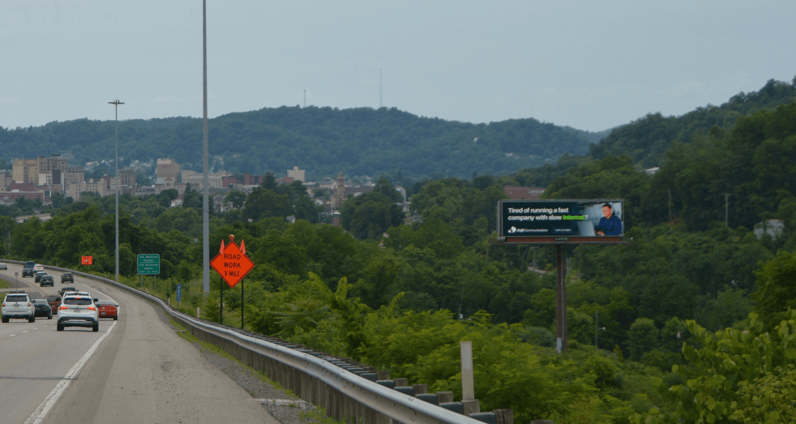 billboard on the side of the highway